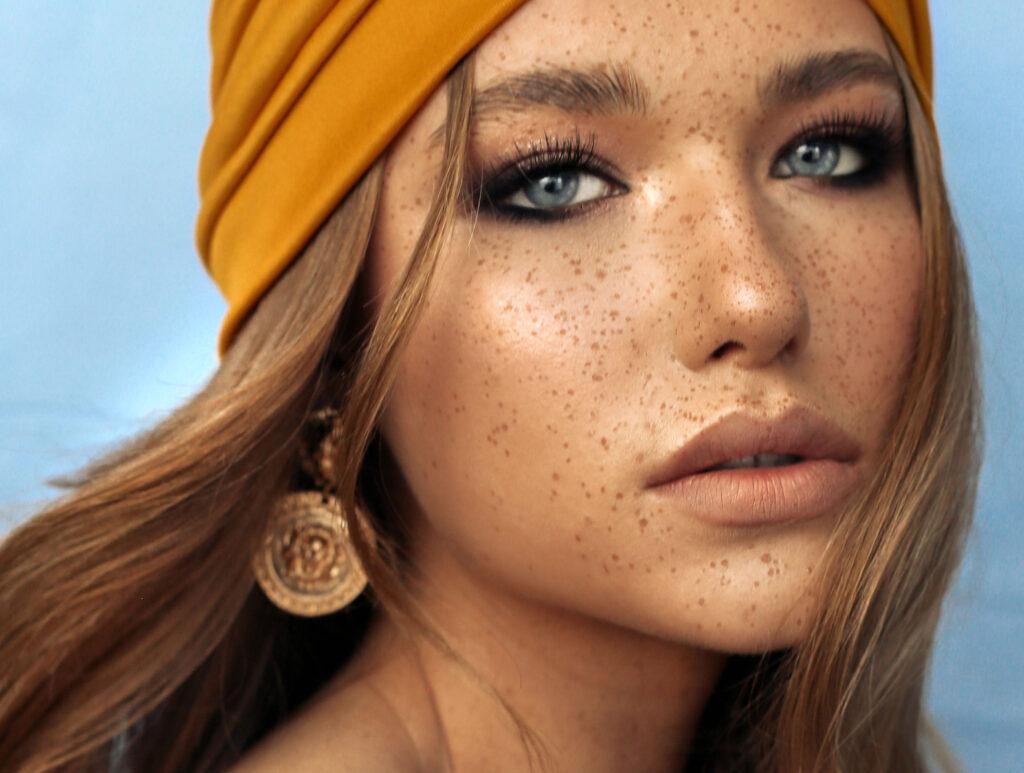 portrait of beautiful young woman with brown hair and freckles f