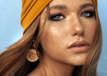 portrait of beautiful young woman with brown hair and freckles f